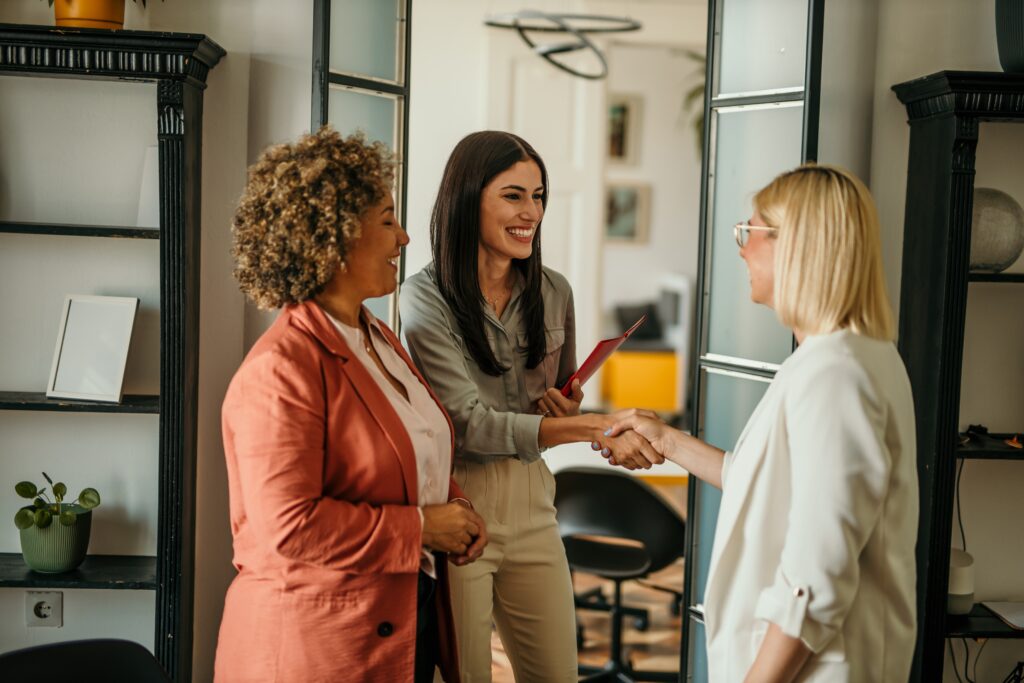 A direct marketing representative shaking hands with a client.
